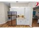 Kitchen showcasing stainless steel refrigerator and ample white cabinetry for storage and organization at 7211 Scenic Hills Blvd, Lakeland, FL 33810