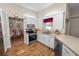 Bright kitchen with stainless steel appliances, white cabinetry, and a view into the dining room at 7211 Scenic Hills Blvd, Lakeland, FL 33810