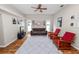 Spacious living room with ceiling fan, lots of natural light, and a comfortable seating arrangement at 7211 Scenic Hills Blvd, Lakeland, FL 33810