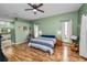 Spacious main bedroom with wood floors, ceiling fan, and natural light at 7211 Scenic Hills Blvd, Lakeland, FL 33810