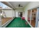 Screened porch with a view of the backyard and playset at 7211 Scenic Hills Blvd, Lakeland, FL 33810