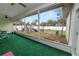 Relaxing screened-in patio with a view of the backyard and play area at 7211 Scenic Hills Blvd, Lakeland, FL 33810