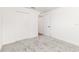 Bedroom featuring plush gray carpet, open doorway, and white closet at 750 W Vine St, Bartow, FL 33830