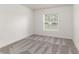 Well-lit bedroom with plush carpet, white walls, and a window offering natural light at 750 W Vine St, Bartow, FL 33830