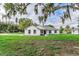 Charming home featuring a well-manicured lawn, fresh landscaping, and a welcoming entryway at 750 W Vine St, Bartow, FL 33830