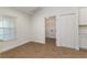 A room with wood-look floors, white trim, closet, and a window providing lots of light at 750 W Vine St, Bartow, FL 33830