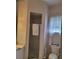 Bathroom features a shower, floral wallpaper, and bright natural light at 940 Ashton Oaks Cir, Lakeland, FL 33813