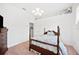 This cozy bedroom features light walls, a four poster bed, and lots of natural light at 940 Ashton Oaks Cir, Lakeland, FL 33813