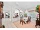 Elegant dining room with chandelier, columns, and an abundance of natural light at 940 Ashton Oaks Cir, Lakeland, FL 33813