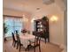 Formal dining room with a chandelier, hutch, and elegant furnishings at 940 Ashton Oaks Cir, Lakeland, FL 33813