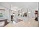 Bright foyer with tile flooring, chandelier, and arched columns at 940 Ashton Oaks Cir, Lakeland, FL 33813