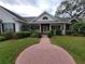 Charming single-Gathering home with a brick walkway and beautifully landscaped yard at 940 Ashton Oaks Cir, Lakeland, FL 33813