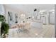 Kitchen and breakfast nook with white cabinets and a view to the garden at 940 Ashton Oaks Cir, Lakeland, FL 33813