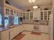 Well-lit kitchen featuring white cabinets, ample counter space, and appliances at 940 Ashton Oaks Cir, Lakeland, FL 33813