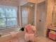 Relaxing main bathroom features large tub, glass shower, and vanity at 940 Ashton Oaks Cir, Lakeland, FL 33813