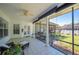 Enclosed porch with tiled floors, ceiling fan, and views to the backyard at 940 Ashton Oaks Cir, Lakeland, FL 33813