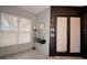 Bedroom featuring natural light with black accent wall and a sliding glass door at 1 Lake Eloise Ln, Winter Haven, FL 33884