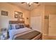 Bedroom featuring a ceiling fan, many decorations, and a closet at 1 Lake Eloise Ln, Winter Haven, FL 33884