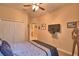 Bedroom featuring a ceiling fan, many decorations, and a closet at 1 Lake Eloise Ln, Winter Haven, FL 33884