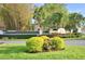 View of Harbour Estates' lushly landscaped, inviting entrance at 1 Lake Eloise Ln, Winter Haven, FL 33884