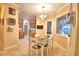 Inviting dining area adjacent to kitchen with modern tile flooring and decor at 1 Lake Eloise Ln, Winter Haven, FL 33884