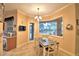 Bright dining area with a window view and stylish table and chairs at 1 Lake Eloise Ln, Winter Haven, FL 33884