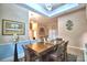 Formal dining room featuring a large wood table, decorative lighting, and artwork at 1 Lake Eloise Ln, Winter Haven, FL 33884