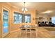 Bright dining area with a view of the pool and access to the living room at 1 Lake Eloise Ln, Winter Haven, FL 33884