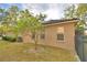 Side exterior view of a well-maintained home, showcasing its clean lines and private backyard at 1 Lake Eloise Ln, Winter Haven, FL 33884