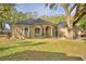 Inviting single-story home with well-maintained landscaping, creating a welcoming curb appeal at 1 Lake Eloise Ln, Winter Haven, FL 33884