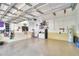 Well-organized garage featuring ample storage space, epoxy flooring, and a convenient utility sink at 1 Lake Eloise Ln, Winter Haven, FL 33884