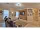 Home theater with a brick accent wall, large screen TV, and comfortable seating at 1 Lake Eloise Ln, Winter Haven, FL 33884