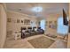 Cozy home theater with reclining seats, movie posters, and a large screen TV at 1 Lake Eloise Ln, Winter Haven, FL 33884