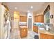 Beautiful kitchen featuring wood cabinets, granite countertops, an island, and pantry at 1 Lake Eloise Ln, Winter Haven, FL 33884