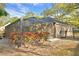 Private screened-in pool area with well maintained foliage providing a tranquil oasis for relaxation and enjoyment at 1 Lake Eloise Ln, Winter Haven, FL 33884