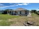 Green grass and lanai at 1155 Motorcoach Dr, Polk City, FL 33868