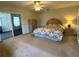 Large main bedroom with sliding doors for outdoor access at 1155 Motorcoach Dr, Polk City, FL 33868