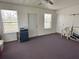 Large bonus room with natural light, neutral paint and multiple doors at 1155 Motorcoach Dr, Polk City, FL 33868