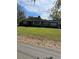 Charming single-story home with a spacious front yard and mature trees at 1197 De La Palma Ave, Bartow, FL 33830