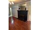 Living room boasts a fireplace, hardwood floors, and neutral paint at 1197 De La Palma Ave, Bartow, FL 33830