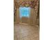 Window with floral valance and tile floor at 1197 De La Palma Ave, Bartow, FL 33830