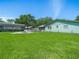Large green backyard with a fenced perimeter, mature trees and above ground pool at 1310 Parker Rd, Lakeland, FL 33811