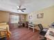 Bedroom with a ceiling fan, desk, bed, and a window at 1310 Parker Rd, Lakeland, FL 33811