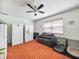 Spacious bonus room with tiled floor, sofa and three refrigerators at 1310 Parker Rd, Lakeland, FL 33811