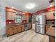 The beautiful kitchen features stainless steel appliances, granite countertops, and wood finish cabinetry at 1310 Parker Rd, Lakeland, FL 33811