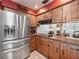 The beautiful kitchen features stainless steel appliances, granite countertops, and wood finish cabinetry at 1310 Parker Rd, Lakeland, FL 33811
