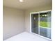 Patio with sliding glass doors and view of the yard at 1752 Burrows Ave, Lakeland, FL 33811