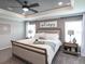 Serene main bedroom retreat with neutral tones, a tray ceiling, soft lighting, and stylish furnishings at 1758 Burrows Ave, Lakeland, FL 33811