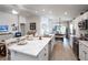 Spacious kitchen features an island with seating, stainless steel appliances and open to the dining area at 1794 Daystar Dr, Haines City, FL 33844