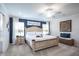Spacious main bedroom with blue accent wall, ceiling fan, and ample natural light at 1794 Daystar Dr, Haines City, FL 33844